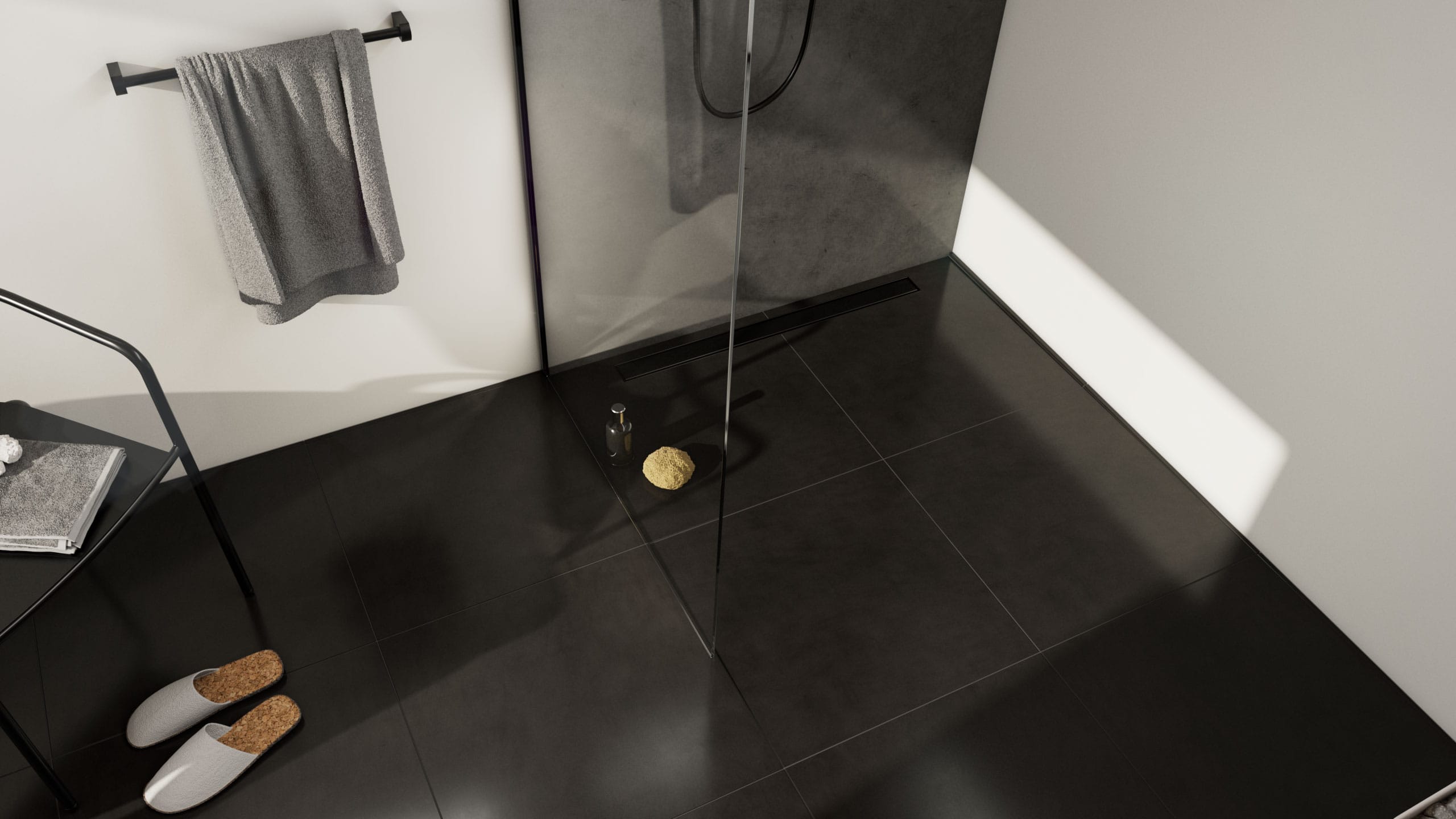 Bodengleiche Dusche mit befliesbarer ACO ShowerDrain C, dunklen Fliesen, Glasabtrennung und modernem, reduziertem Design